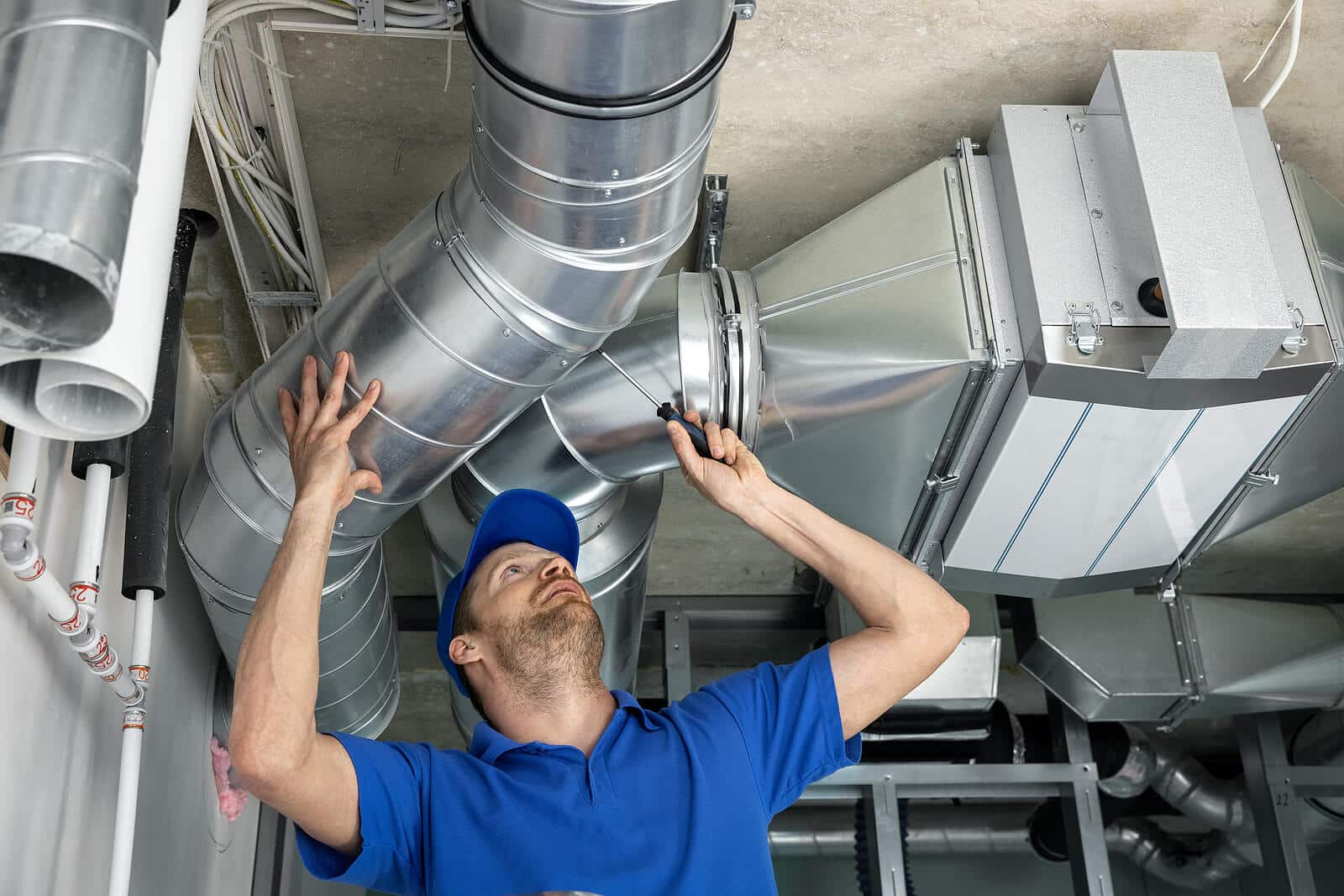 HVAC technician inspecting and repairing air ducts in Citrus Heights