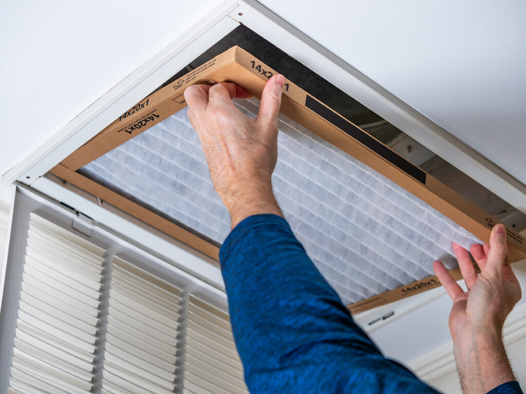 HVAC technician replacing a home air filter in Citrus Heights