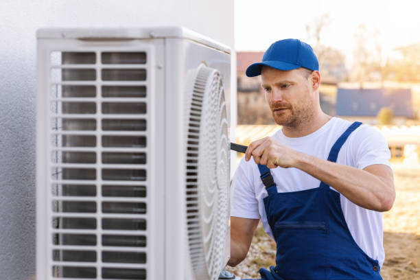 HVAC technician servicing an outdoor air conditioner in Citrus Heights