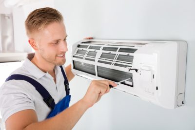 HVAC technician maintaining a ductless air conditioner in Citrus Heights