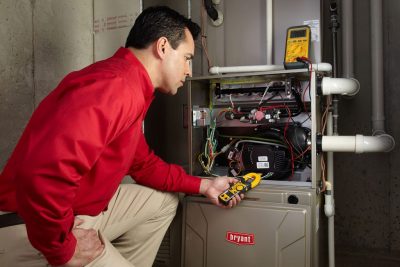 Heating technician diagnosing a furnace repair in Citrus Heights