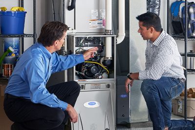 Technician evaluating a furnace for repair or replacement in Citrus Heights