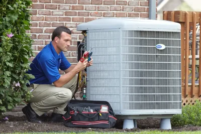 HVAC technician inspecting an outdoor AC unit in Citrus Heights